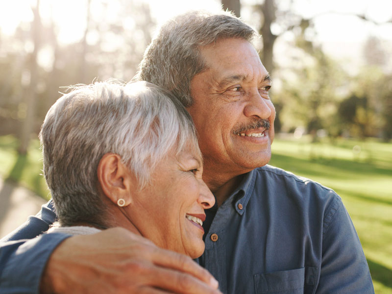 older man and wife enjoying nature